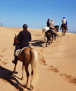Horse riding in a desert