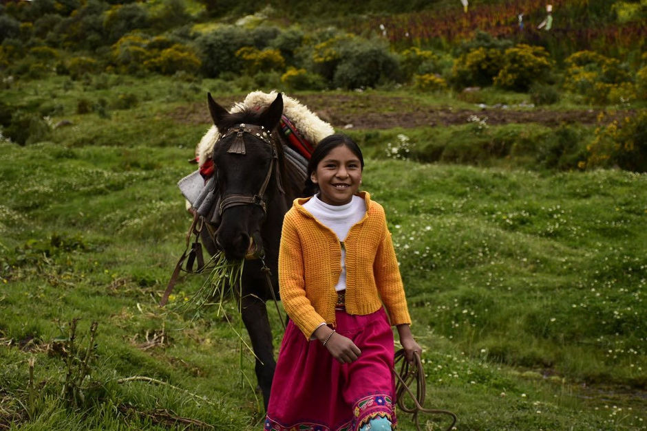Girl with a horse in Peru