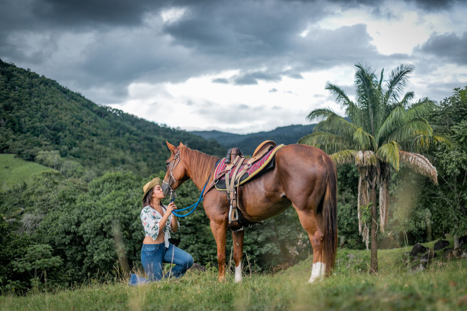 Woman kisses a horse in Panama