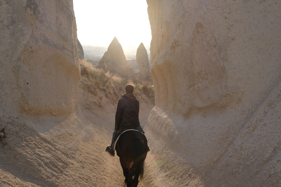 A man riding a horse in Cappadocia