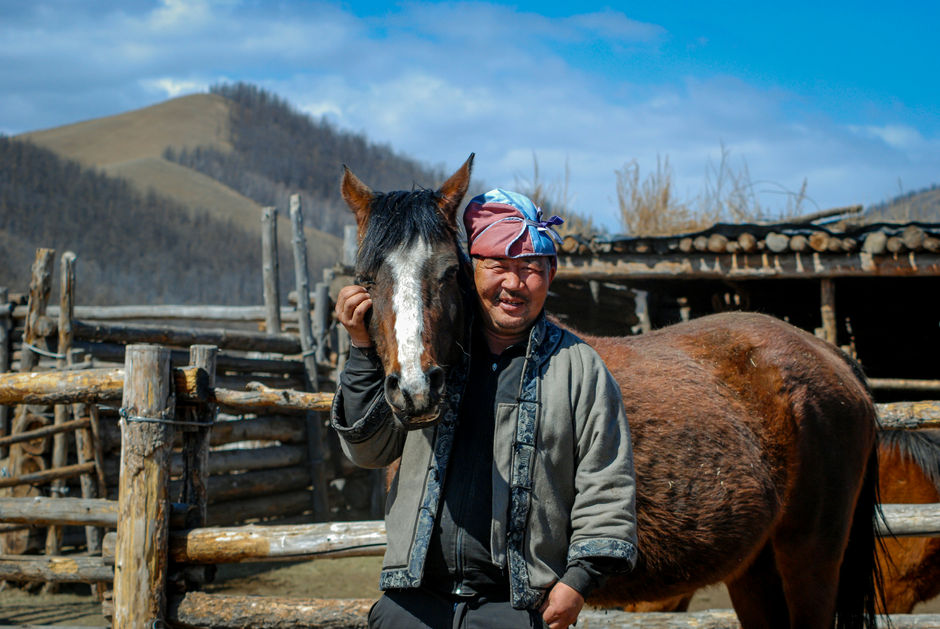 Mongolian man with a horse
